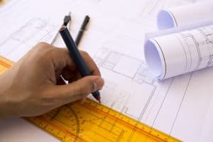 Professional home designer working on house plans