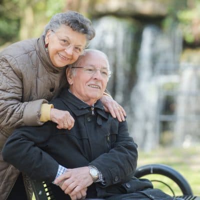 Older couple with wheelchair planning for accessibility