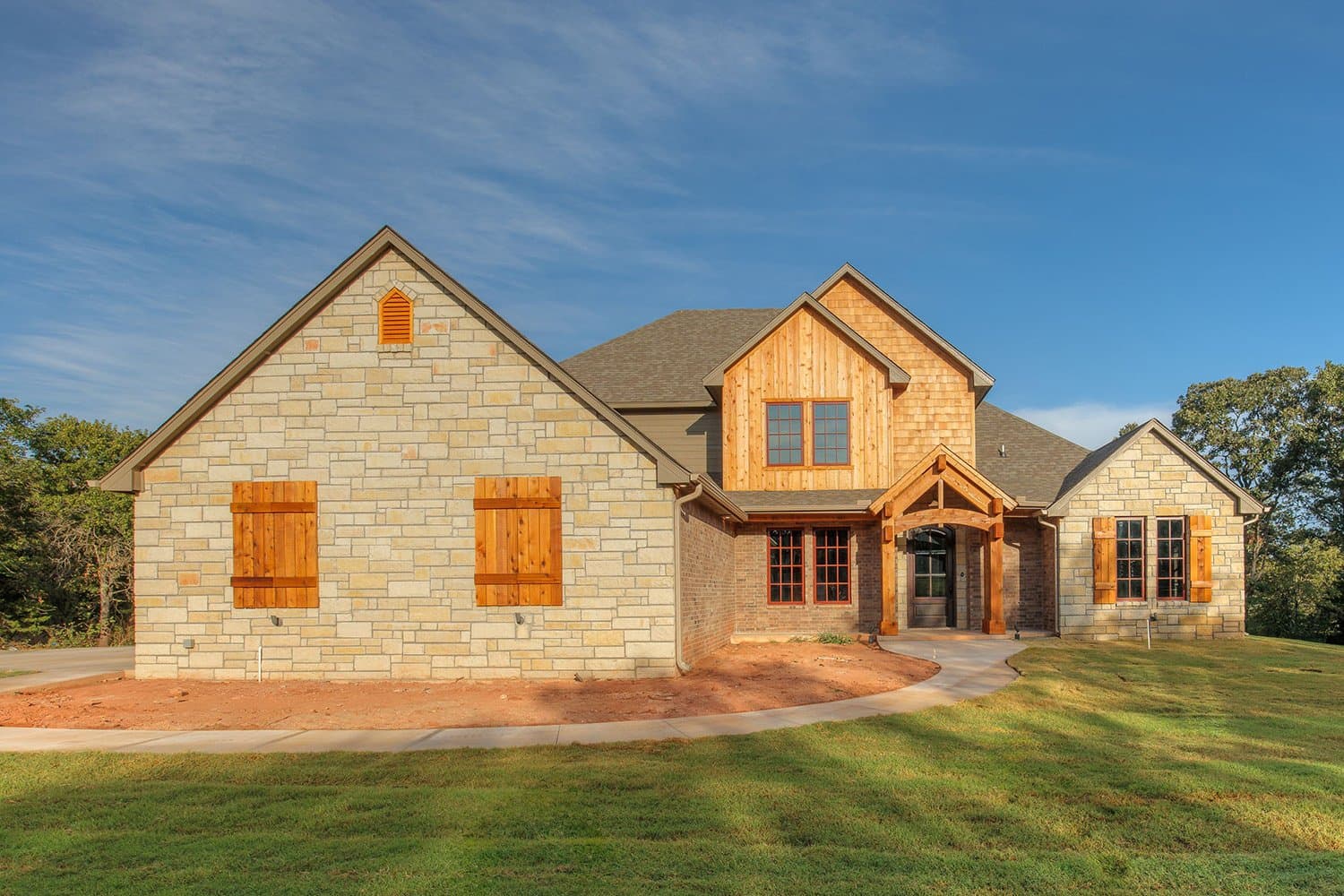 Stone and wood siding custom home