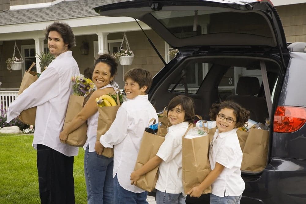 family unloading groceries