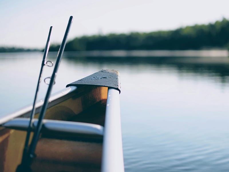 Peaceful lake view with fishing poles at Lake Chickasha close to Minco Oklahoma
