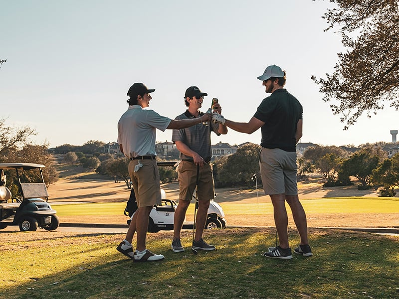 Friends celebrating on the course at Winter Creek Golf Club in Blanchard Oklahoma