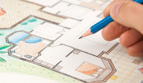 Person drawing home plans